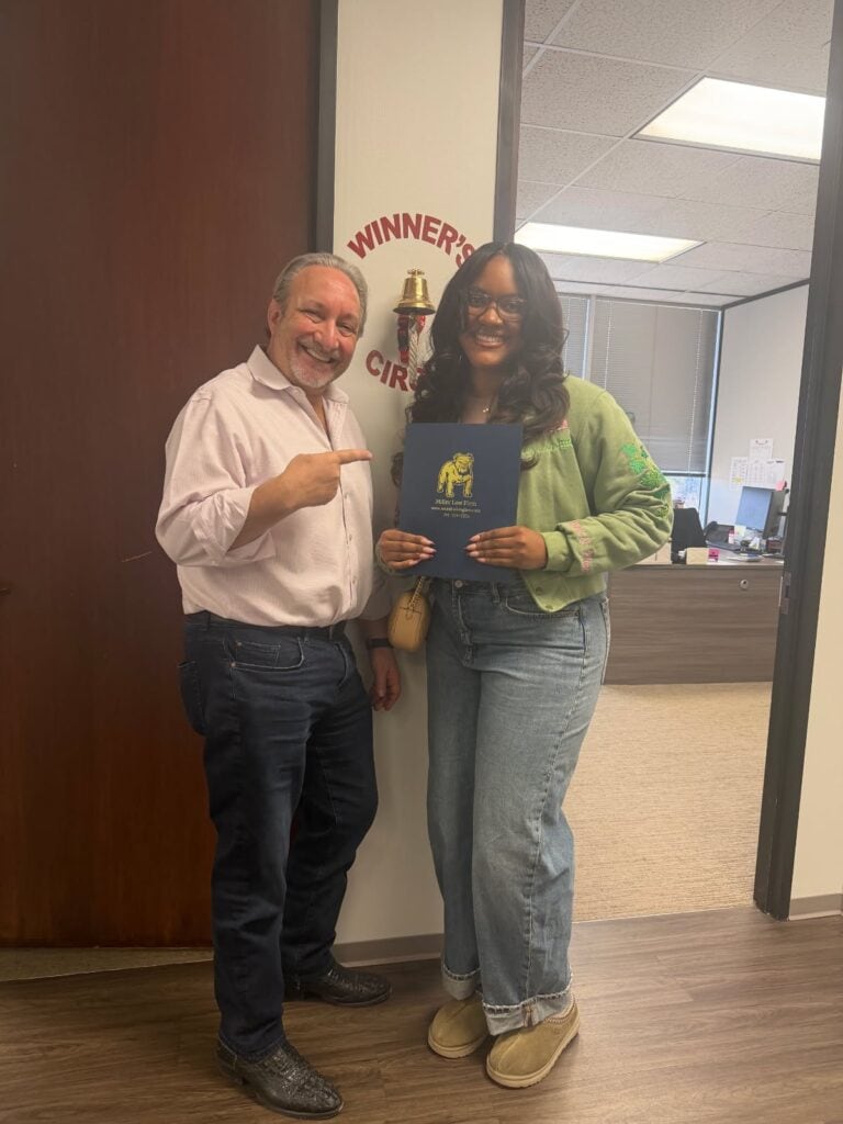 Houston accident client ringing winners circle bell