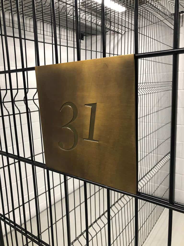 Apartment identification sign in storage area in Regent's Crescent Apartments