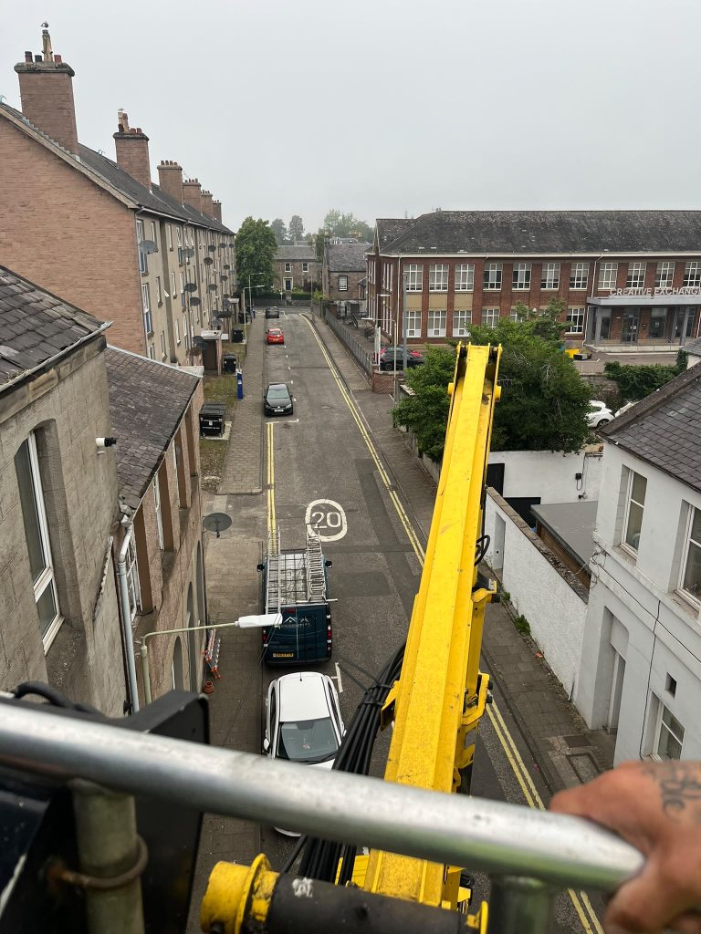 Seeing city from crane while installing Roof