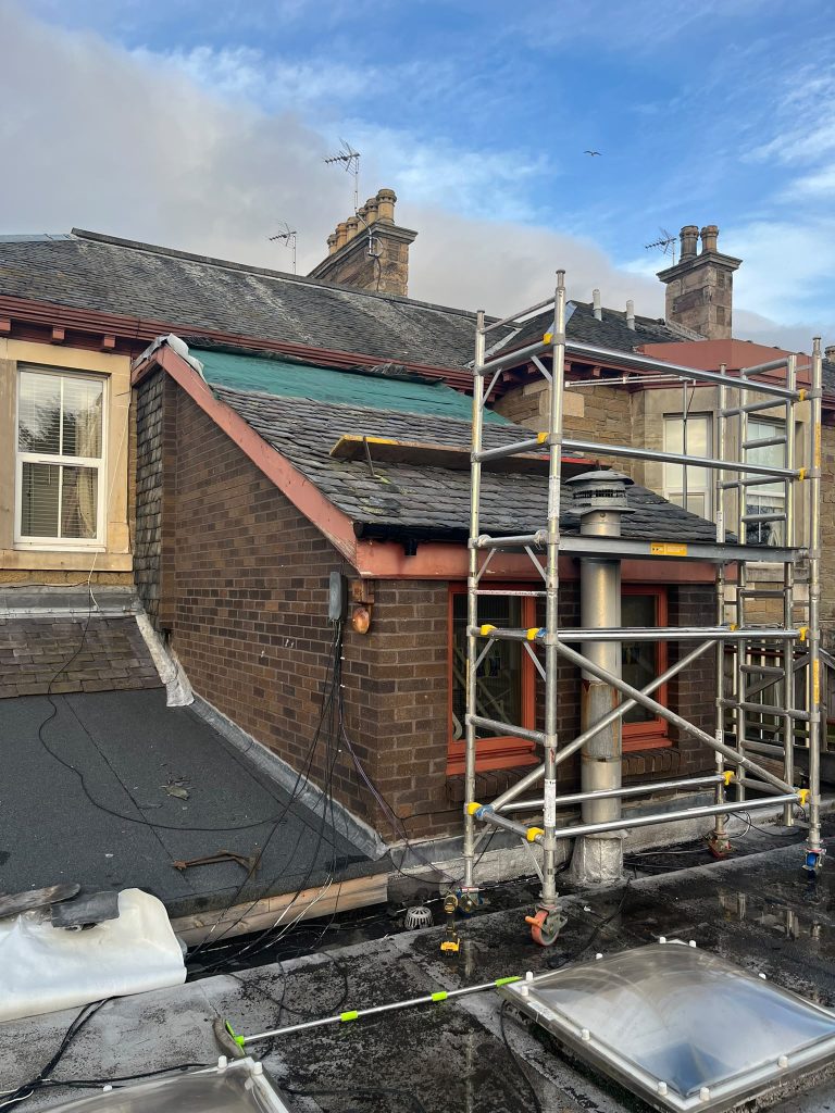Ladder on roof while installing roofs