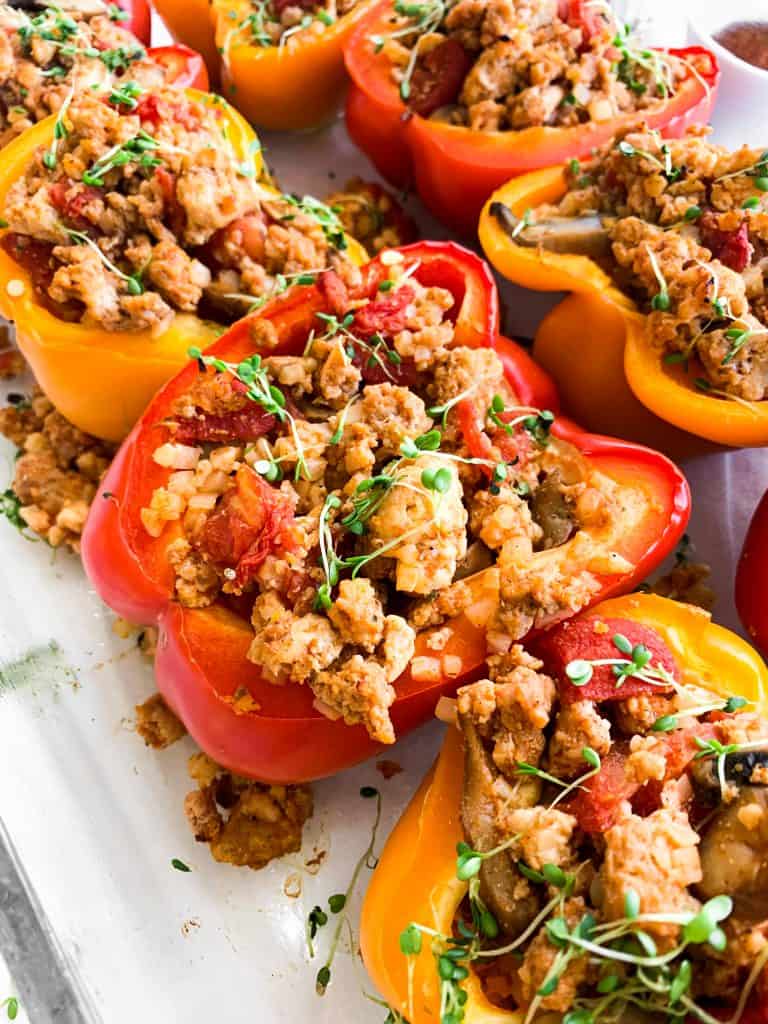 Whole30 Stuffed Peppers with ground turkey, mushrooms, tomatoes, and spices.