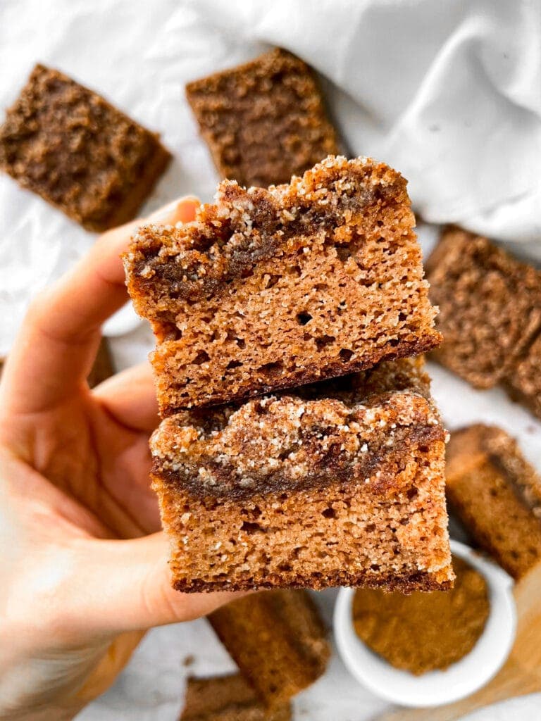 holding 2 squares Paleo Coffee Cake