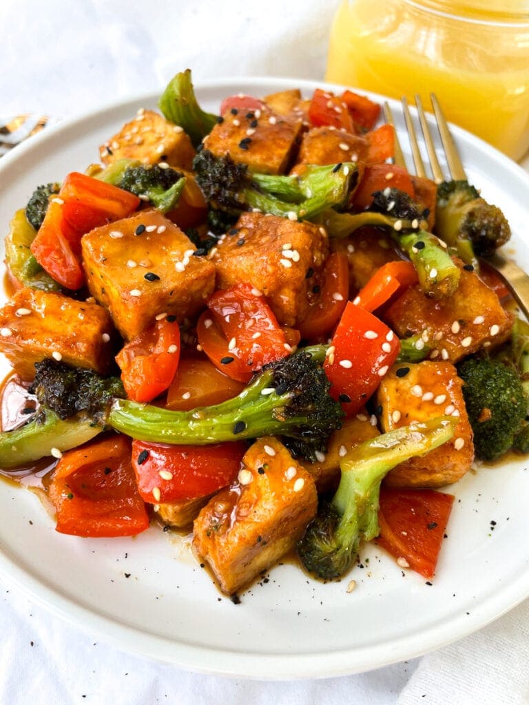 side shot of tofu made with orange juice and veggies