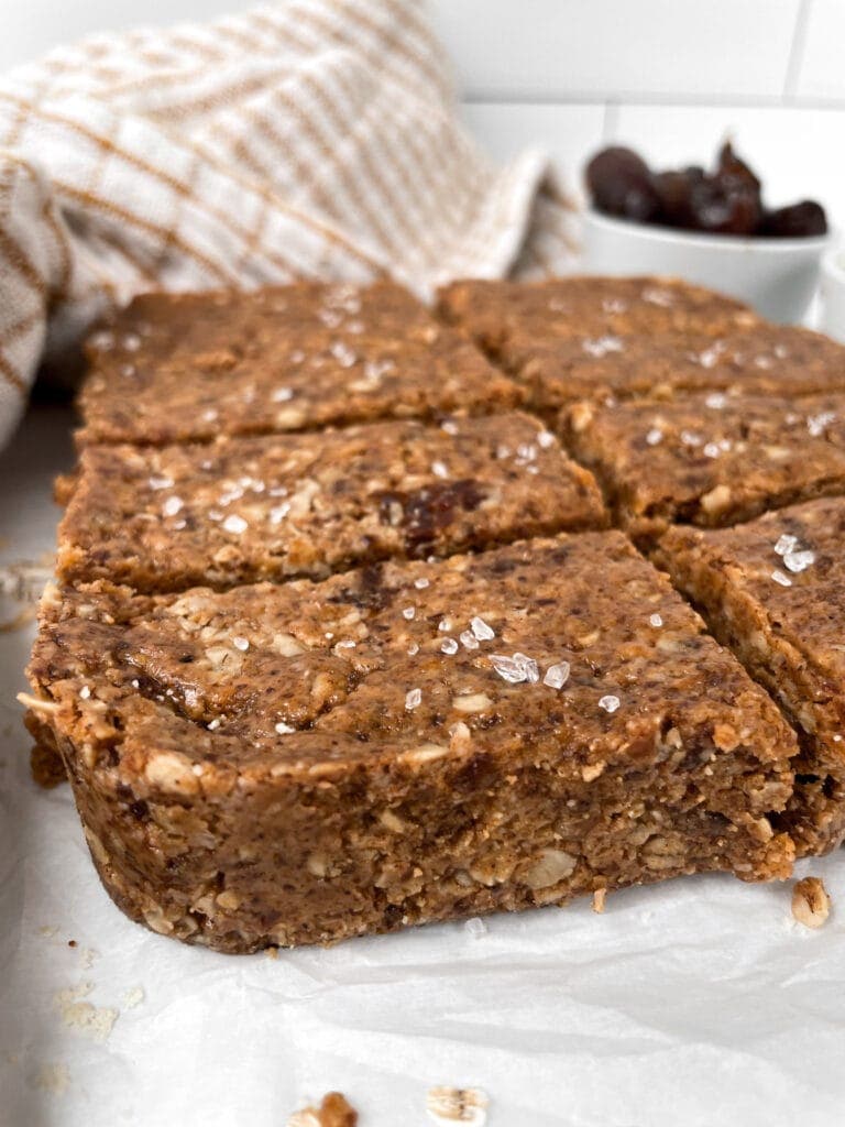 close up of oatmeal date bars on parchment paper