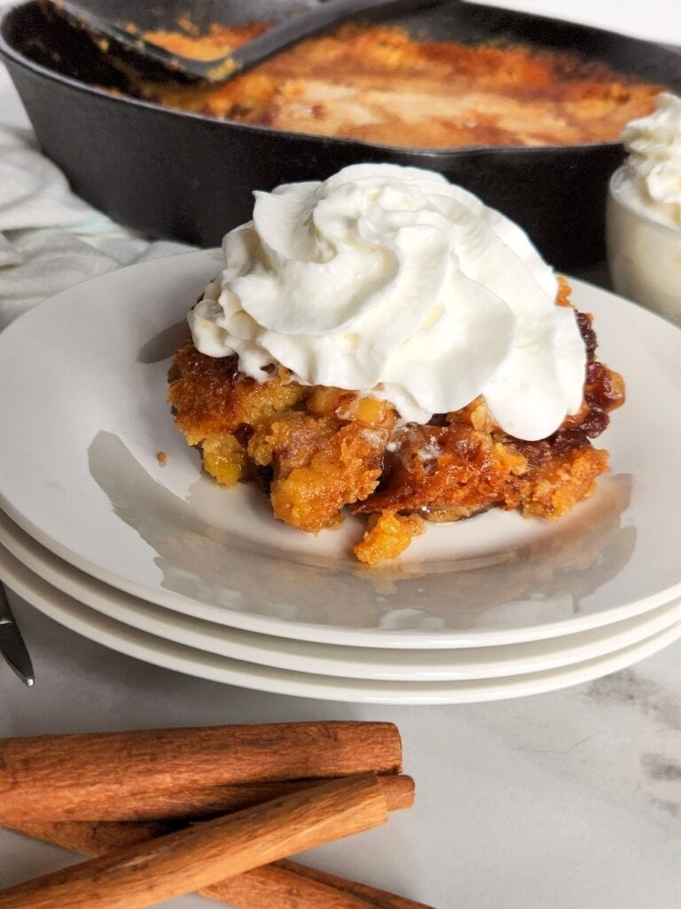 Easy Skillet Apple Dump Cake with spiced apples and a golden buttery topping. Perfect fall dessert for the whole family in just 40 minutes.