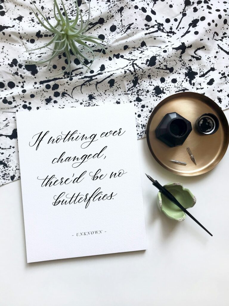 'If nothing ever changed, there'd be no butterflies' written on a card. Overcome your limiting beliefs 