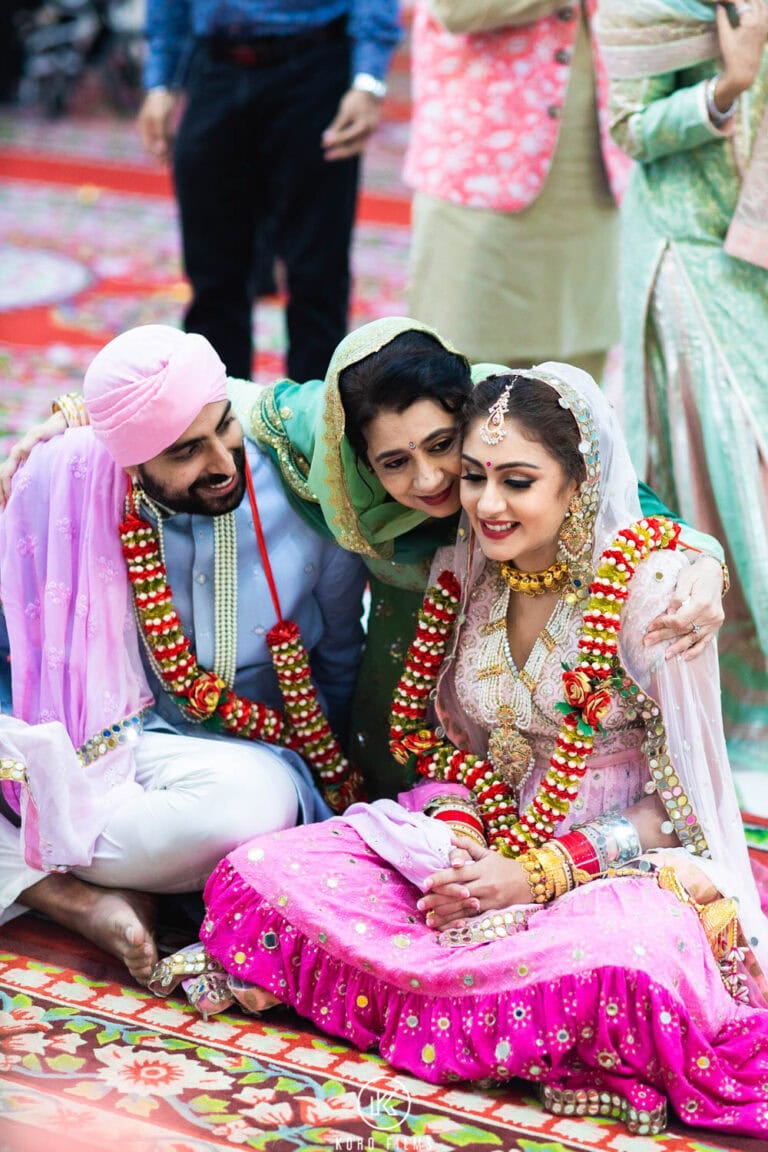 Relatives bless the newlyweds after their Anand Karaj in Bangkok