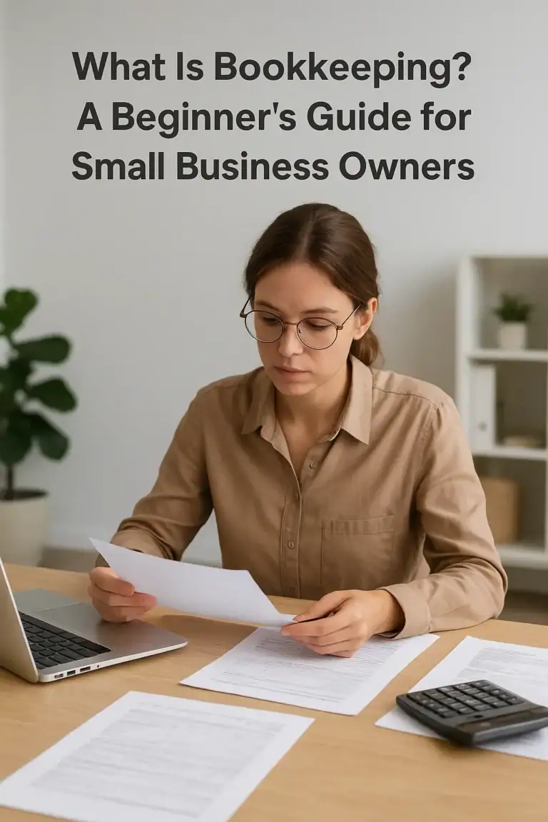 A Bookkeeper in a home office reviewing documents with laptop and calculator on the table. The words "What Is Bookkeeping? A Beginner's Guide for Small Business Owners" are over the top of the image.