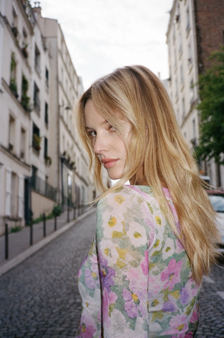 Model wearing a floral asymmetrical dress by Marcia Paris, a French fashion label similar to Sézane
