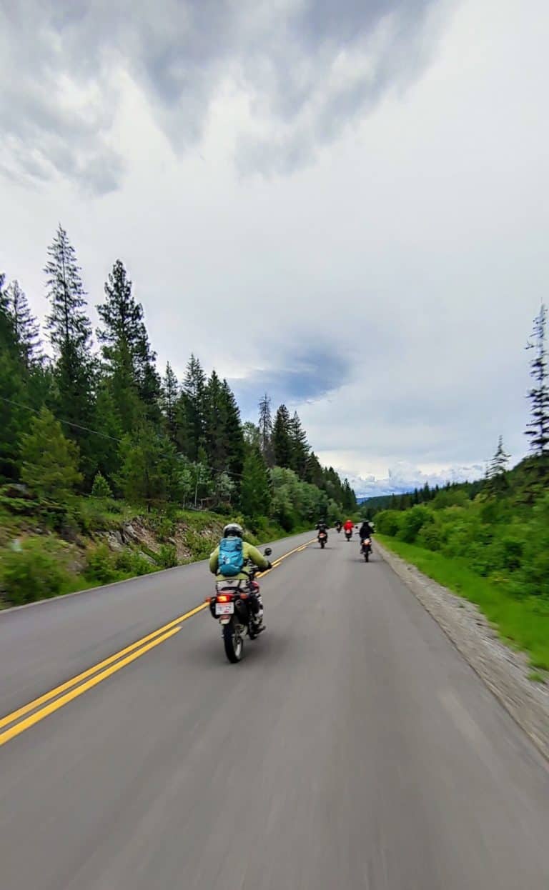 group of dual sport motorcycle riders on road
