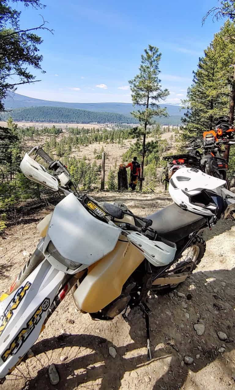 Motorcycles on a trail overlooking east kootenays