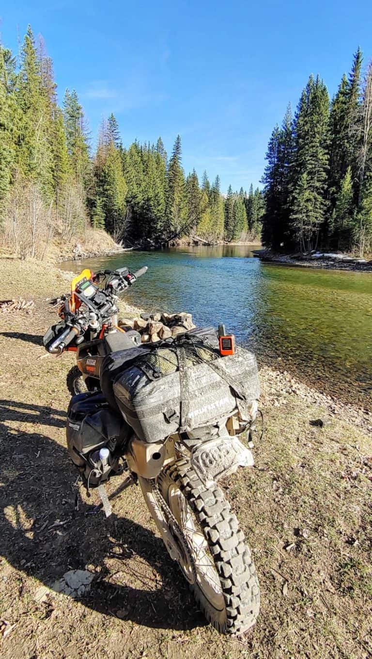 motorcycle with camping luggage next to at Mary's river