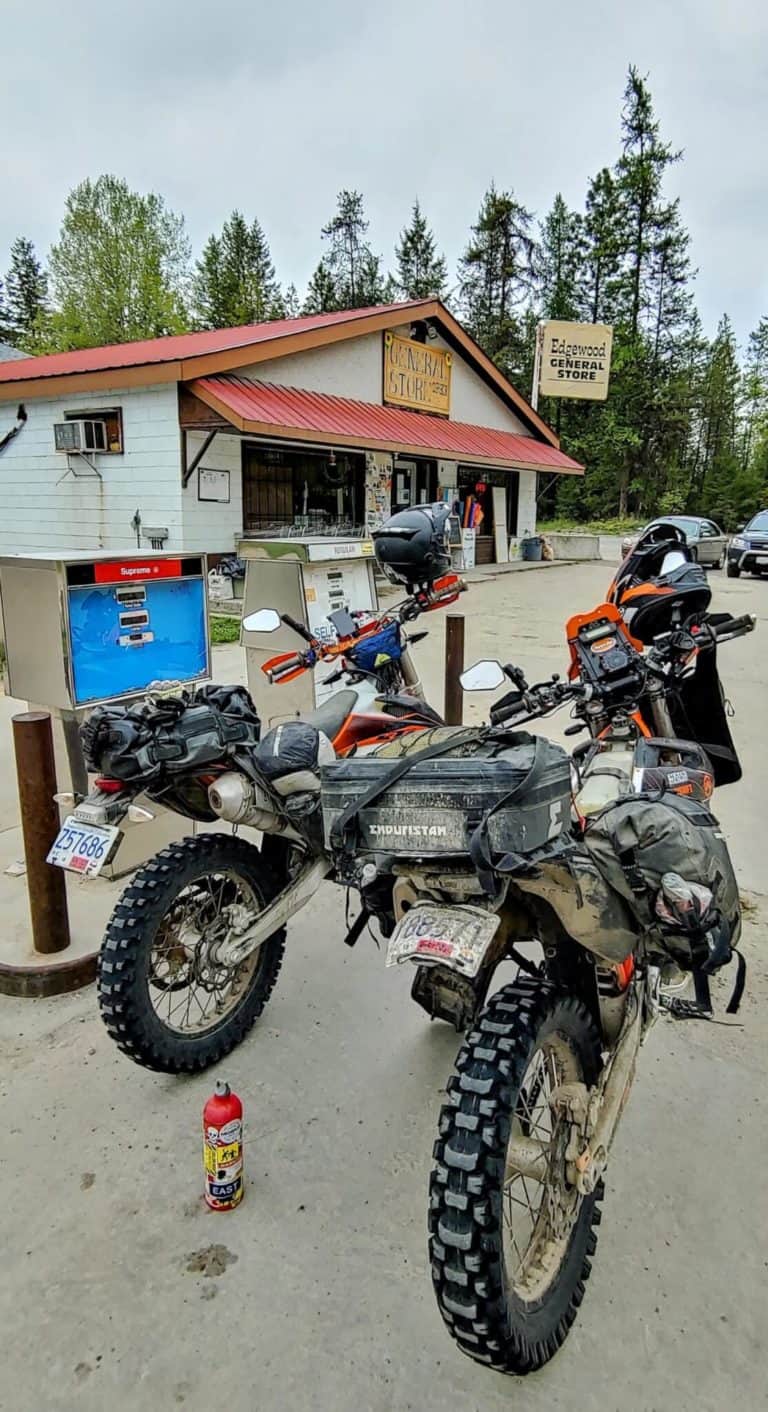 two adventure motorcycles getting gas
