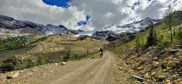 Motorcycle rider on FSR to Farnham Glacier