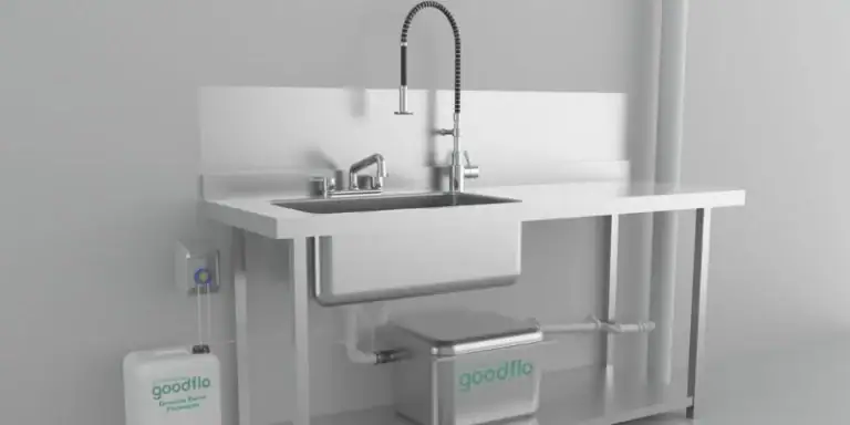 grease_trap - Grease interceptors work to trap grease - silver industrial sink with grease trap underneath