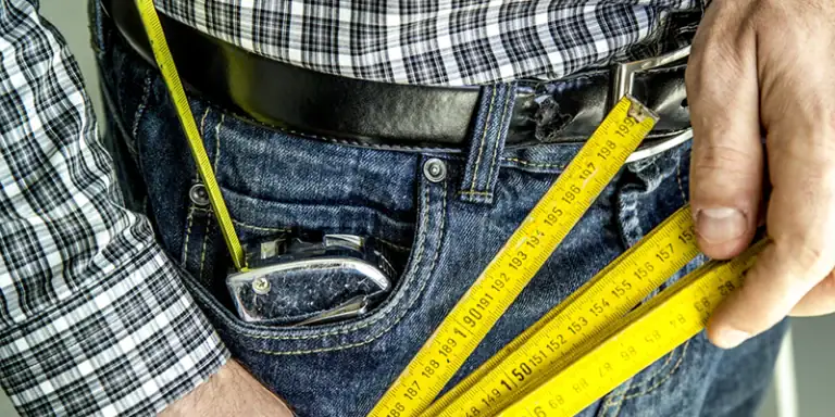dryer vent - dryer vent - person holding tape measures