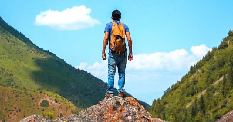 man on a mountain with a view of the oaxaca nature in mexico