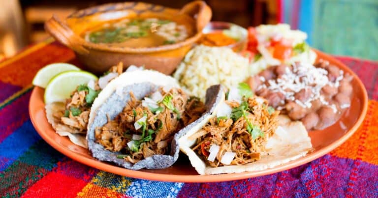 different Oaxacan dishes in a plate - best Oaxaca street food tours