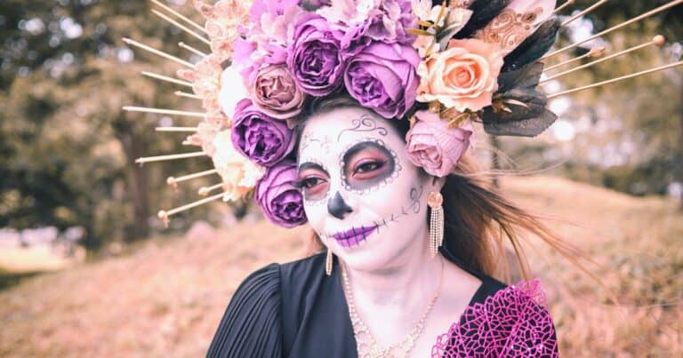woman with her face painted for oaxaca day of the dead in mexico