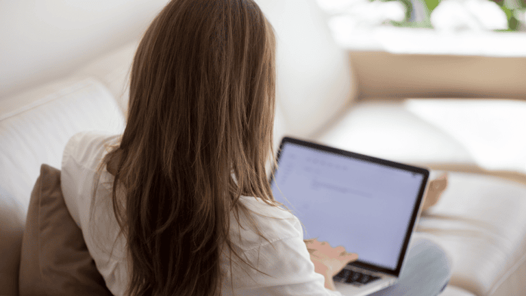 Photo shows image of woman writing a well-crafted resignation letter.