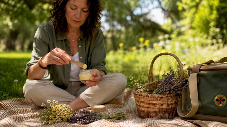 Woman applying natural balm for insect bites