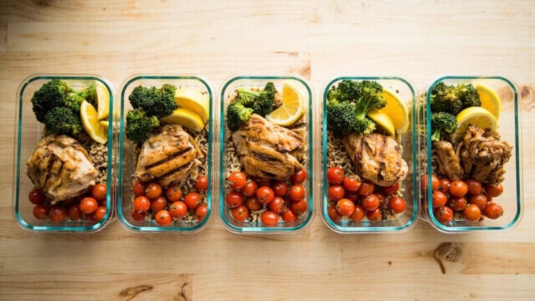 proven nutritious meals strategies — meal prep containers with grilled chicken and vegetables