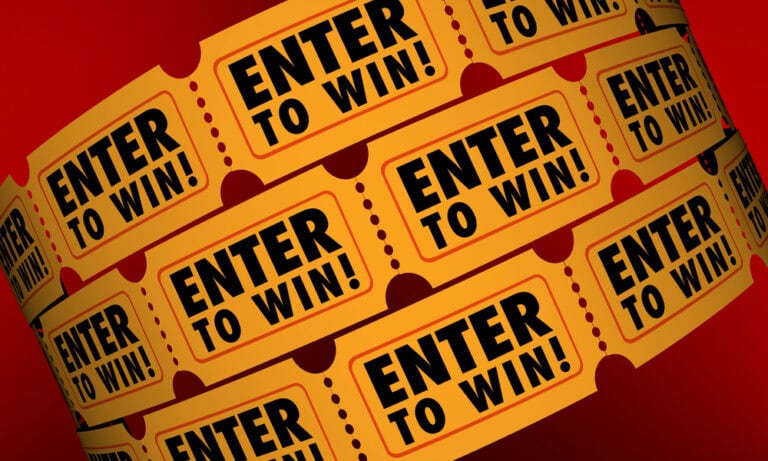 A series of yellow tickets that say "ENTER TO WIN!" on a red background