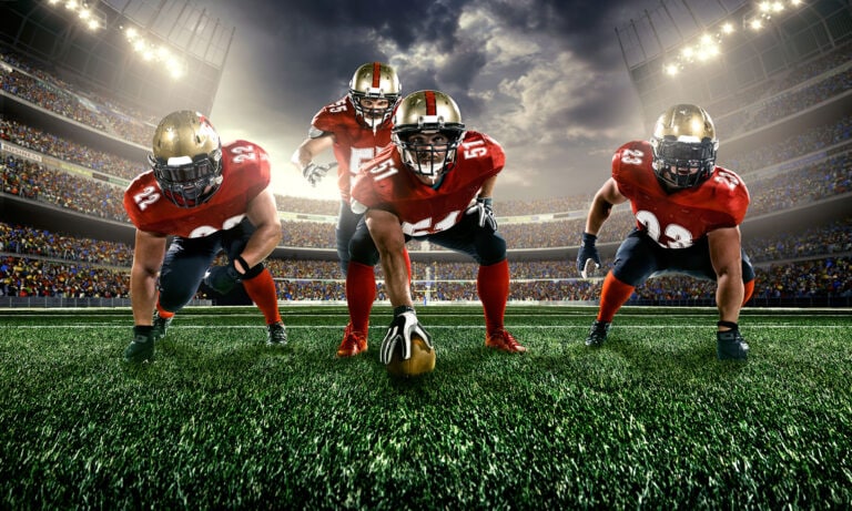 A group of football players are on the field.