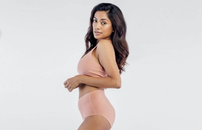 Woman in profile view showing smooth body contours, representing body contouring or liposuction results