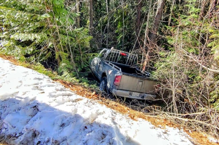 truck crashed off the road because of snow