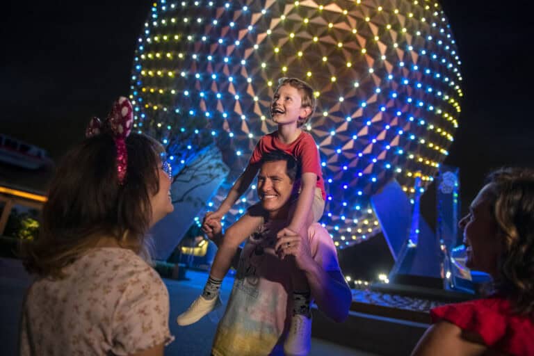 407vacations-family enjoying nighttime at Epcot illumination.