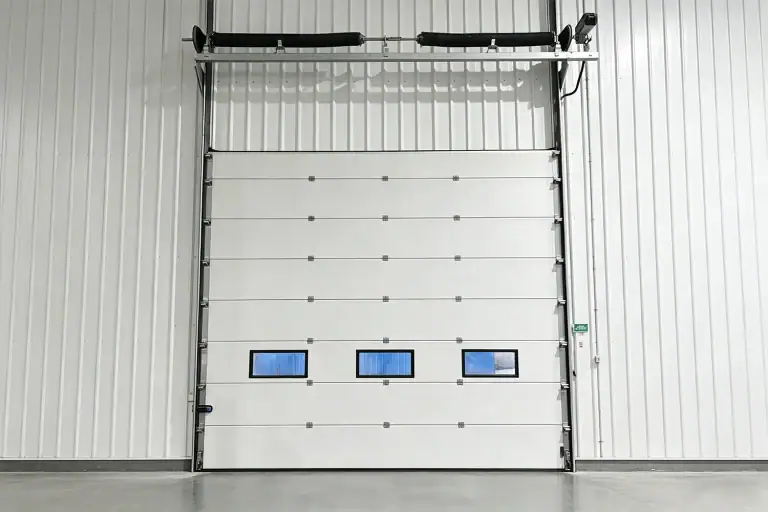 Heavy-Duty Commercial Sectional Overhead Door with Wind Struts and Vision Panels Built for US Wind Load and Hurricane Compliance