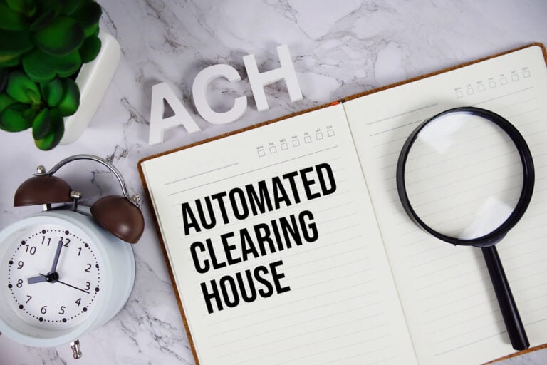 ACH - Automated Clearing House acronym on notepad, Business and Financial concept background