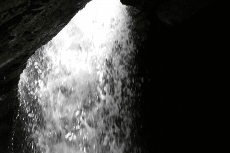Water fall view from the inside of the cave in Donut fall trail Utah