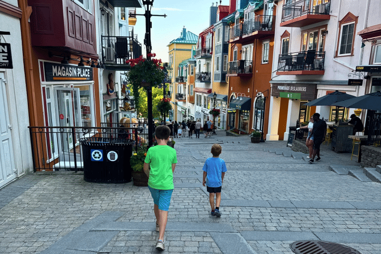Two little boys walking down the cobble stones streets of Mont Tremblant