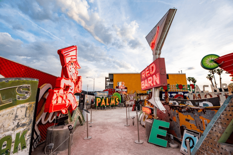 Some old neon signs scatters around a path with ropes