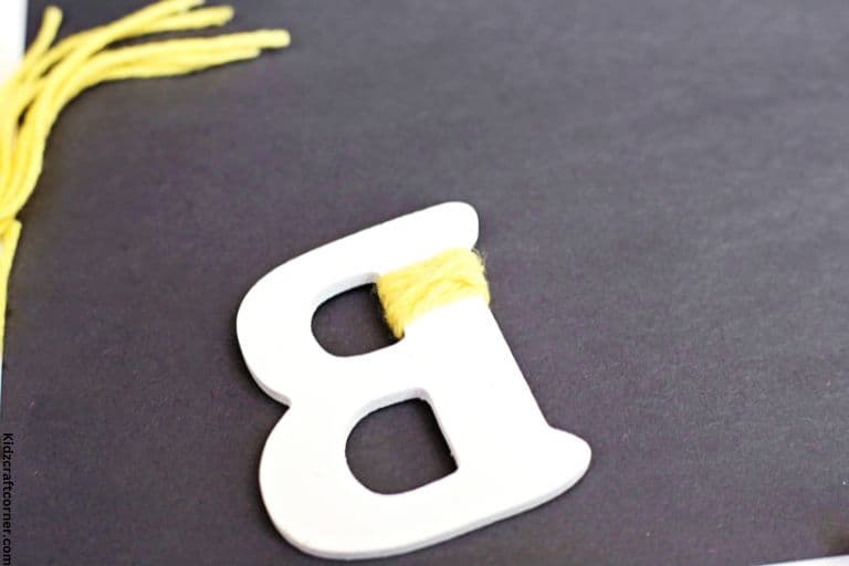 start wrapping b craft with yellow yarn