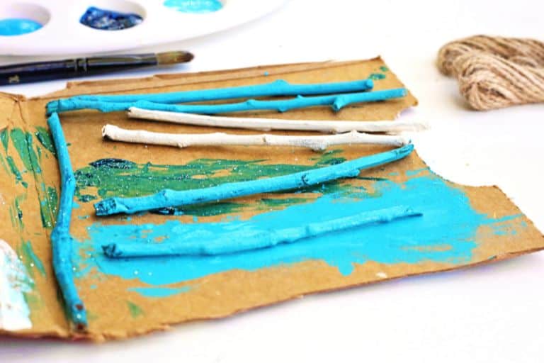 sticks and blue and white paint