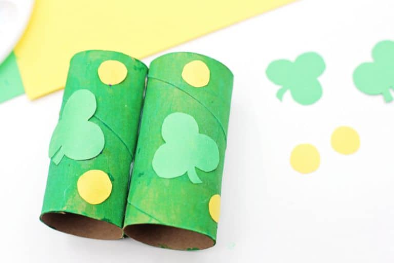 glue shamrock shapes on green binoculars