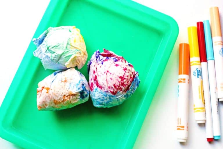 place egg in center of colorful paper towel for dyeing