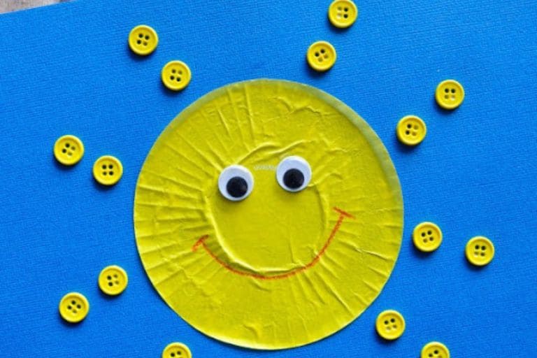 yellow cupcake liner sun craft with yellow buttons