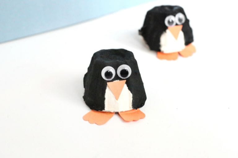 cute black and orange penguin made from egg carton