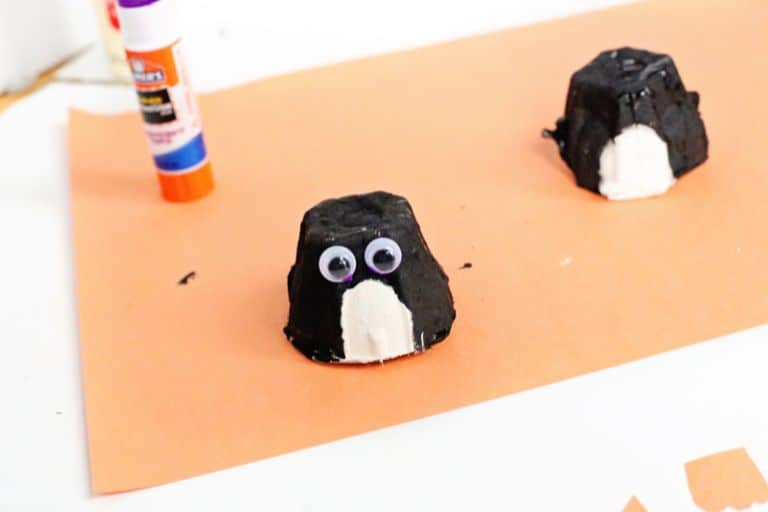 glue on penguins eyes