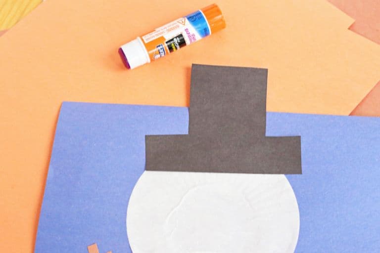 glue on the snowmans black hat