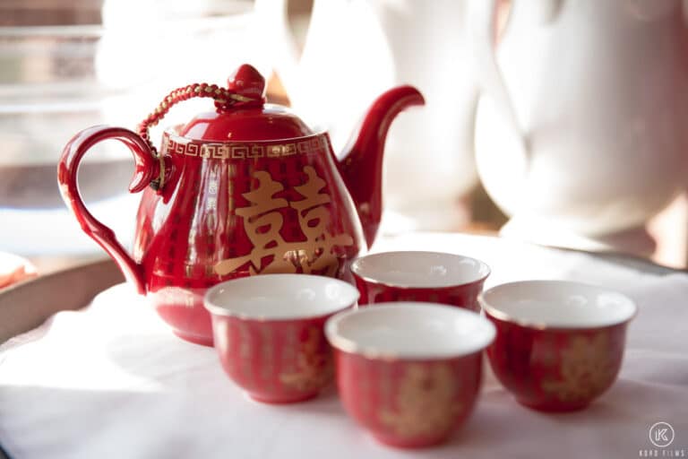 Red teapot and cups with the double-happiness sign for the wedding tea ceremony at Dusit Thani Hua Hin
