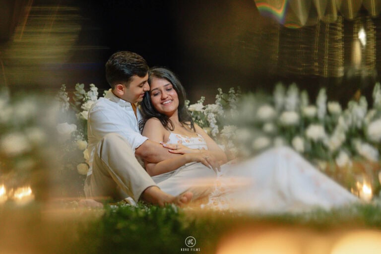 Paridhi laughs in Vatsal’s arms in the garden at night, framed by warm lights, Hua Hin