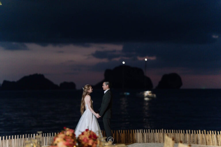 Alessandra and Bruno at blue hour with the limestone islands of Krabi behind them at Rayavadee