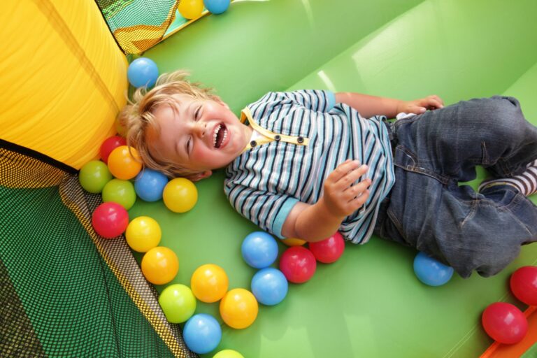 boy in bounce house