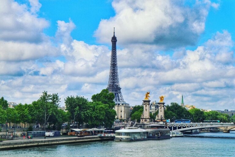 Pont Alexandre III viewed from the Seine with Eiffel Tower rising behind