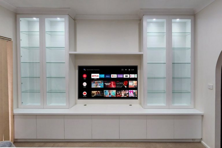 Custom-made entertainment unit in Hornsby. Poly painted in vivid white. This Was made for a customer who wants to display his collection of navy memorabilia. All with soft close, push touch glass doors and led down lights.